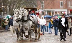 Santa arrives in a horse-drawn carriage on Nantucket Island