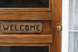Welcome sign on the door of the Brass Lantern entrance