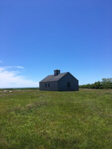 a building in a green field 