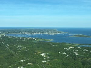 aerial view of the ocean and homes 