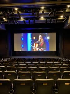 a theater with seats and a screen 